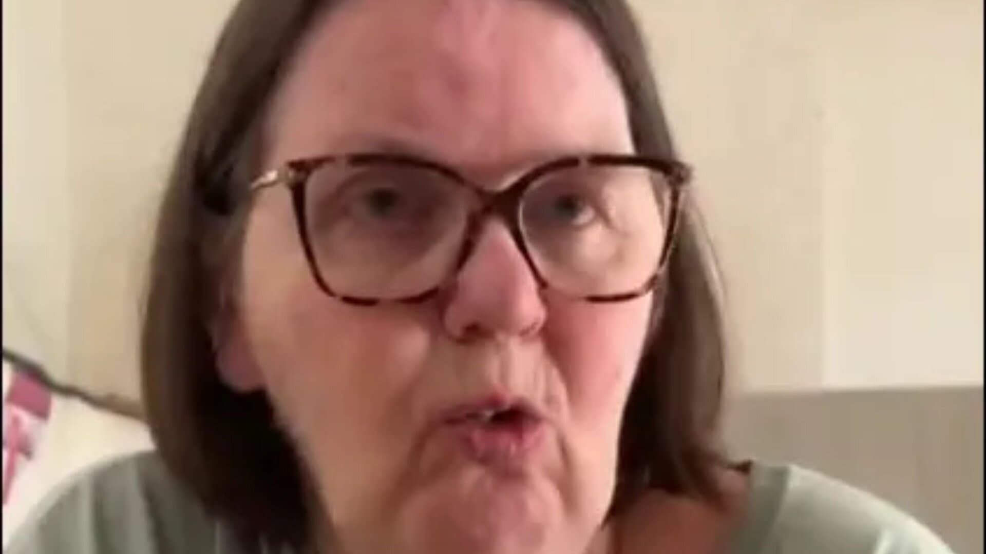 A woman is taking legal action against a company that paid her for 20 years despite not assigning her any work